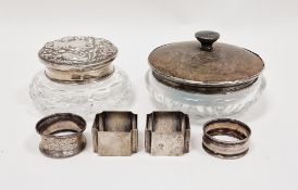 Two glass dressing table powder jars, one with a silver and tortoiseshell lid, Birmingham 1927, W