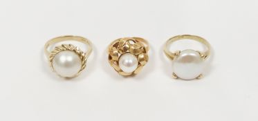 9K gold and half blister pearl ring (size P), a 14K gold and pearl stylised flowerhead ring (size J)