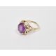 14K gold and purple stone ring, the oval stone in scroll bordered mount (size P) - Image 1 of 2