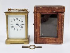 Late 19th / early 20th century gilt brass cased carriage clock with bevelled glass panels, the white