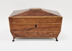 Regency rosewood and satinwood string inlaid tea caddy of sarcophagus form, the hinged lid opening
