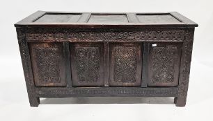 17th century oak coffer, the three-panel hinged lid opening to an empty space, the four-panel