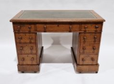 Mid Victorian oak twin-pedestal desk, the green leather inset top with thumbnail moulded edge,