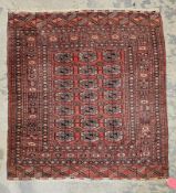 Eastern red ground rug with three rows of seven elephant foot guls, multiple geometric borders 123cm