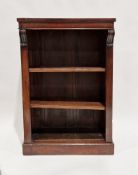 Victorian mahogany dwarf bookcase with two adjustable shelves and carved scroll mounts, raised on