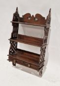 Late 19th/early 20th century mahogany hanging bookshelf with two shelves and two small drawers, with