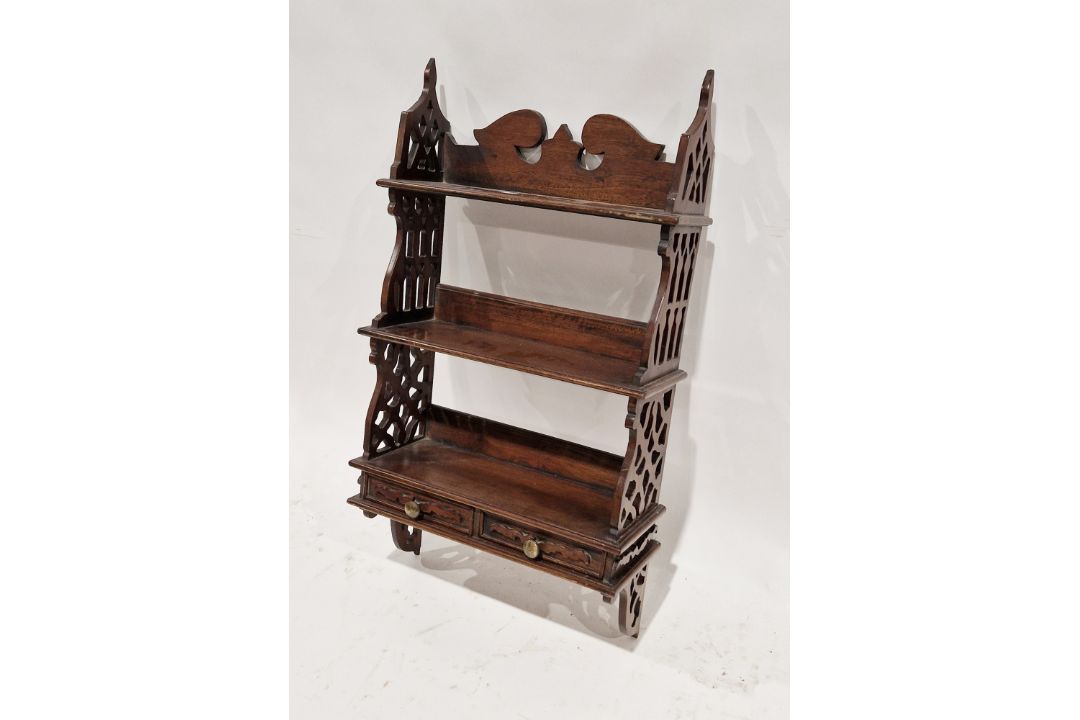 Late 19th/early 20th century mahogany hanging bookshelf with two shelves and two small drawers, with
