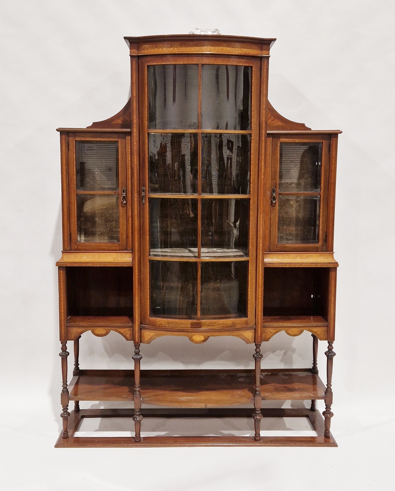 Edwardian mahogany and satinwood inlaid and cross banded display cabinet, the central bow fronted