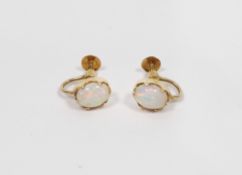 Pair of 18ct yellow gold and opal earrings, each earring holding an oval claw set white opal of