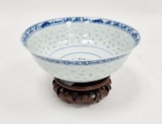 Asian porcelain bowl with slightly everted rim, rice windows to sides and four-character mark to