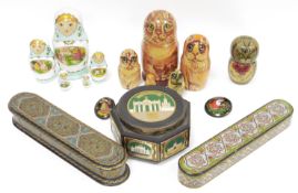 Two Persian painted wooden pen boxes, longest 26cm together with a set of wooden painted Russian