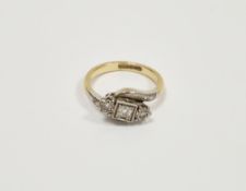 18ct yellow metal and platinum cross-over diamond ring, being illusion set with three round cut