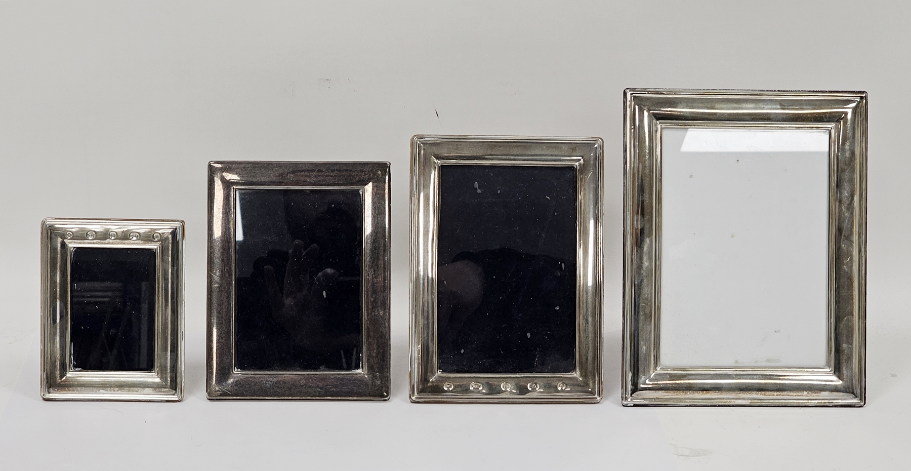 Four silver and wooden easel back photograph frames, Sheffield 2000, 2001 and 2002, Carr's of