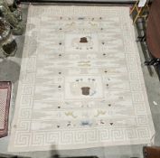 Large modern cream ground rug with two geometric medallions featuring elephants on geometric and