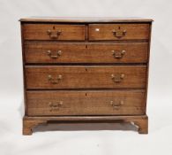 Early 19th century oak chest of two short over three graduating long drawers, the top with ogee