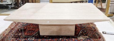 Italian Travertine marble coffee table of rectangular form with shaped sides and raised on a