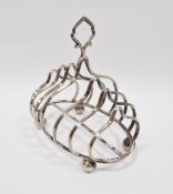 Edward VII silver toastrack, Birmingham 1906, J Sherwood & Sons, six shaped sections and raised on