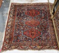 Persian-style wool rug with triple hexagonal totem on a midnight blue ground of plants, birds and