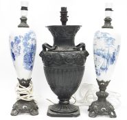 Pair of early 19th century oviform Continental pottery lamps, each printed in the Delft style with