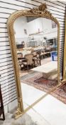Very large 19th century giltwood and gesso framed overmantel mirror, the arched top with a shell and