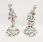 Pair of late 19th century French porcelain figures of a gallant gardener and companion, each wearing