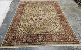 G.H. Frith Ltd Oriental cream ground rug with central floral lozenge pattern field, multiple