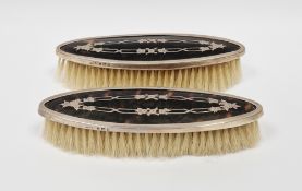 Pair of George V silver and tortoiseshell backed dressing table brushes, Birmingham 1919, makers