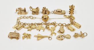 9ct gold oval link charm bracelet with quantity charms and sundry gold loose charms, 60g total
