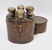 Early 20th century four-bottle cologne or spirit flask set, each with silver plated screw-on caps