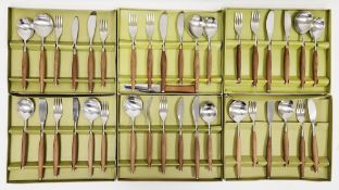 Six boxed sets of two person place settings by Wallin, Sweden, stainless steel with teak handles