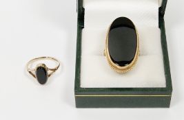 9ct gold and black onyx large oval ring (size O) and 9ct gold and onyx small oval ring (size J1/