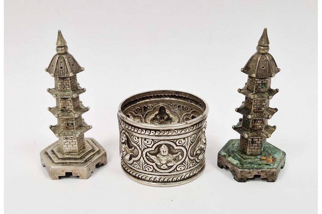 Pair of Chinese white metal pepperettes in the form of pagodas stamped ' On Hing ' to base, 7cm high - Image 1 of 4