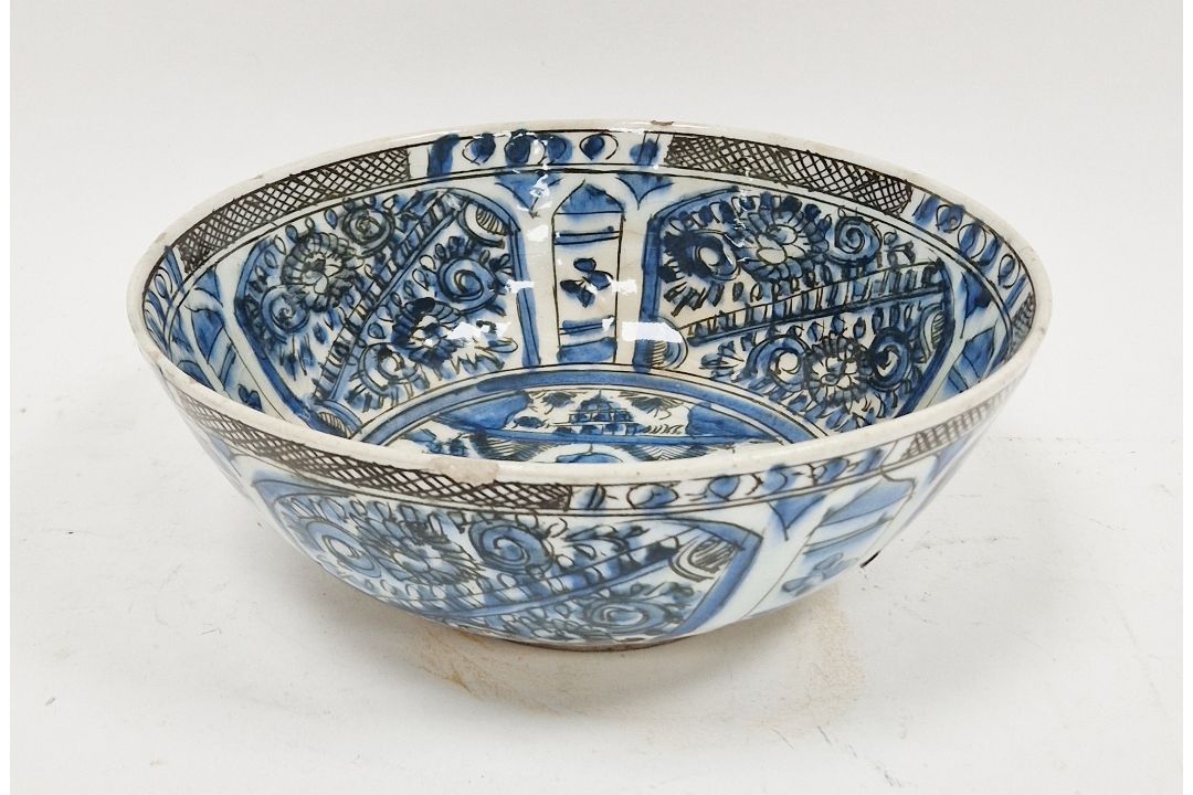 Persian (Iran) blue and white bowl, 18th century, painted with panels of flowers and lappet-shaped - Image 1 of 2