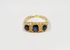 18ct gold, sapphire and diamond dress ring set three oval sapphires interspersed with four small