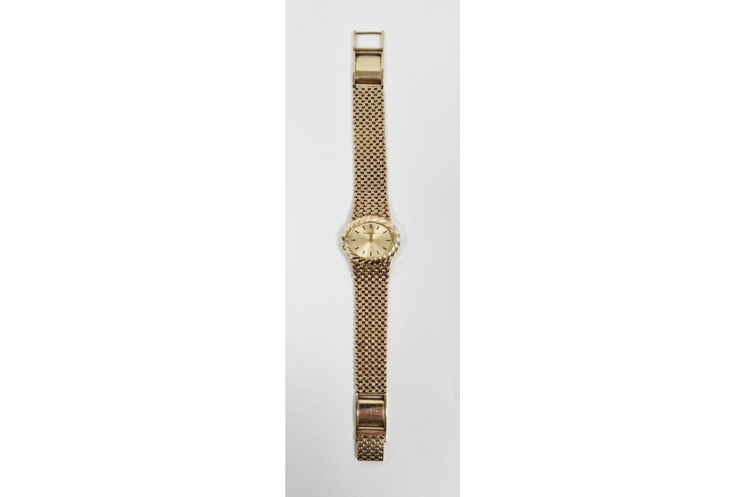 Bueche-Girod 9ct gold wristwatch, the oval champagne face with rope border, on integral basket weave