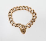 9ct gold fancy curb link bracelet with chased decoration and engraved padlock clasp, 33.6g approx.