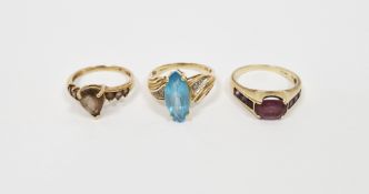 9ct gold and purple stone set dress ring, a 9ct gold and brown stone dress ring and a 9ct gold and