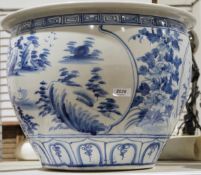 Large blue and white handpainted Eastern-style jardiniere decorated with coastal scenes
