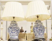 Pair of lamps converted from blue and white Chinese-style ginger jars, bearing foliate and floral