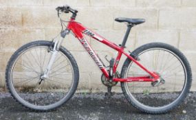 Red Specialized competition Hard Rock mountain bike with enhanced butted aluminium alloy frame