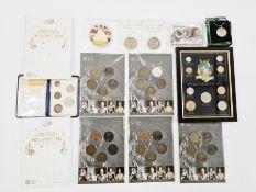 A mixture of coin related items to include a framed set of pre decimal coins, 2 x Miss Potter 50p