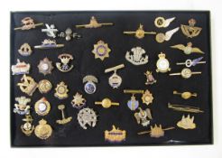 Collection of 41 military sweetheart brooches to include a silver example to the East Yorkshire