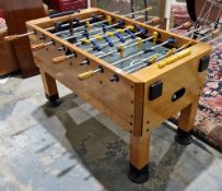 Harvard table football in a mahogany-effect frame, with one football playing piece, 141cm long x