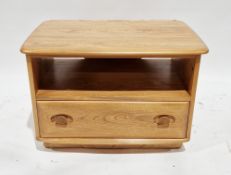 Ercol pale elm entertainment stand with corner drop flap to back, having a shelf and drawer below,