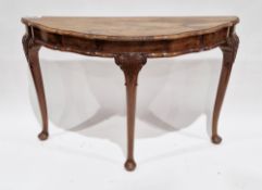Early to mid 20th century walnut demi-lune console table by Shora Furniture, the top with shaped