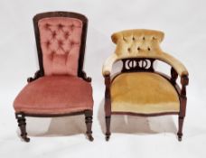 Late Victorian gold coloured upholstered button back tub chair with pierced carved splats and raised