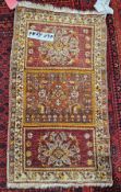 Antique Iranian small rug with three panels of interesting design and colours of reds, orange,