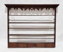 18th century oak dresser rack with moulded dentil cornice, scrolling carved top rail with pierced