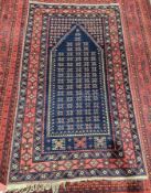 Turk Y Bedir with certificate, blue centre on red with interesting designs and borders with red,