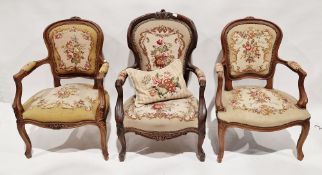 Pair of French elbow chairs in the Louis XV manner, with floral woolwork upholstered seats, arm